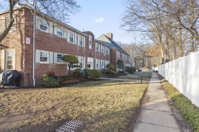 a view of a building with a yard