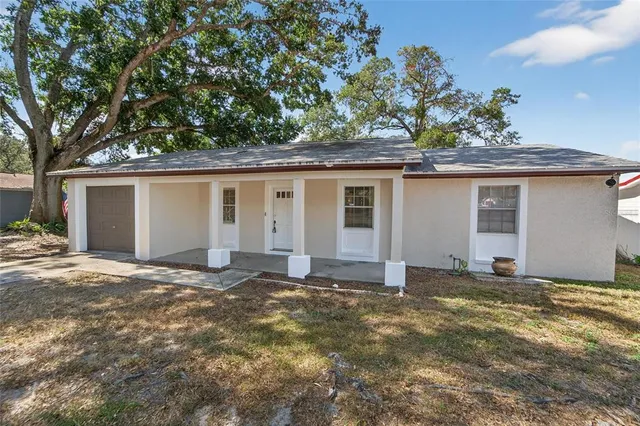 front view of a house with a yard