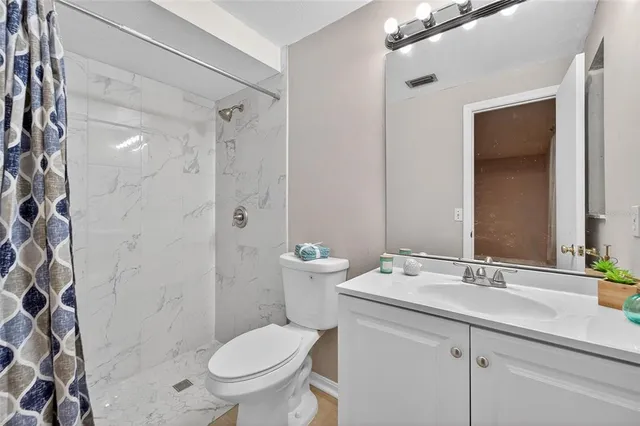 a view of a kitchen cabinets and stainless steel appliances