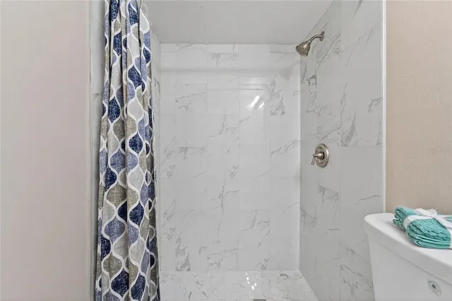 a view of an empty room with windows