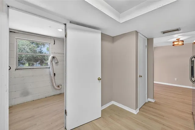 a view of a house with backyard and a tree