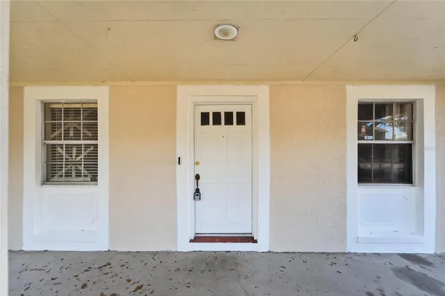 a view of room with hardwood floor and window