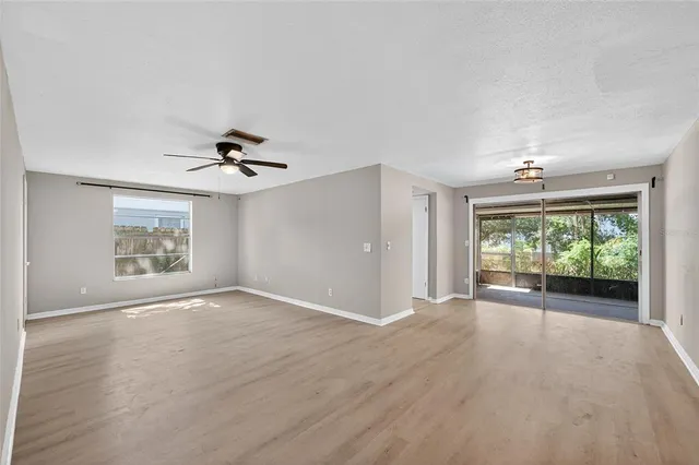 a kitchen with a refrigerator sink and cabinets