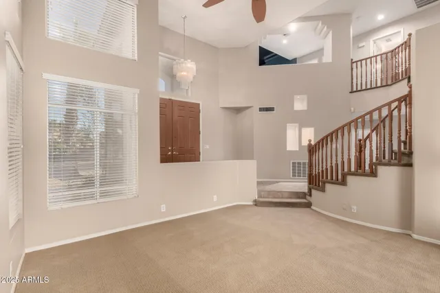 an empty room with windows and entrance