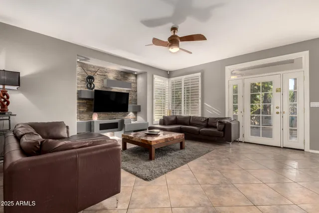 a living room with furniture and a kitchen view