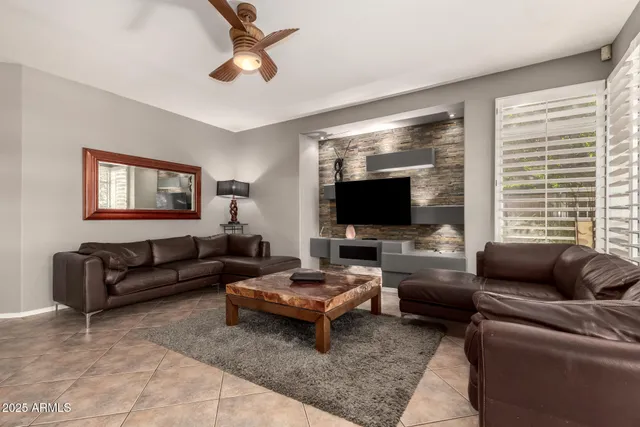 a kitchen with stainless steel appliances granite countertop a sink a stove and a wooden cabinets