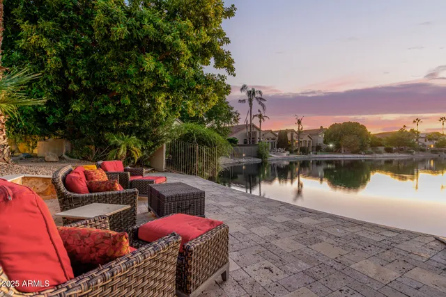 a view of a balcony with two chairs and a table
