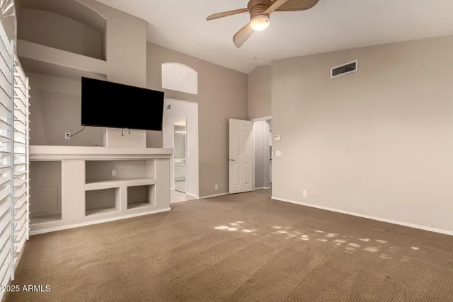 a spacious bathroom with a granite countertop tub shower sink and mirror