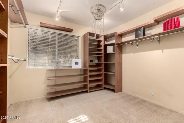 a bathroom with a granite countertop toilet sink and mirror