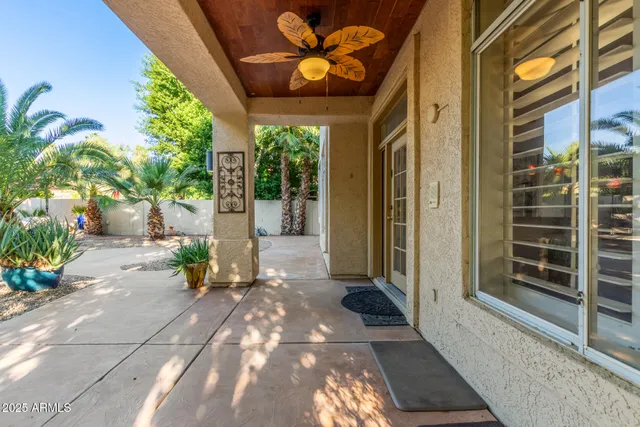 a swimming pool with outdoor seating and yard