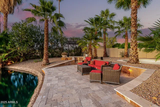 a view of outdoor space with seating area and trees