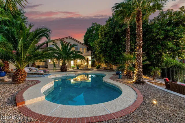 a view of a swimming pool with sitting area