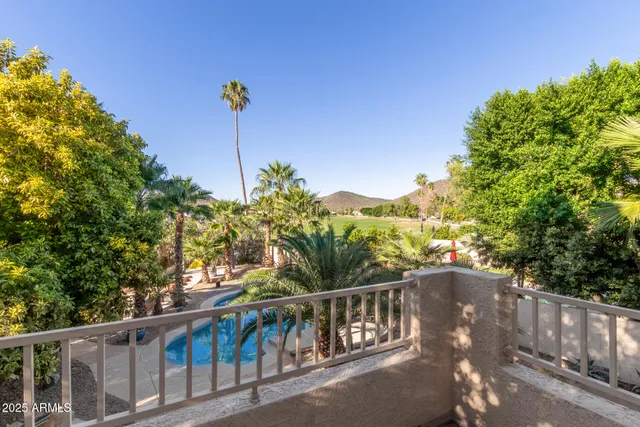 a view of a balcony with chairs
