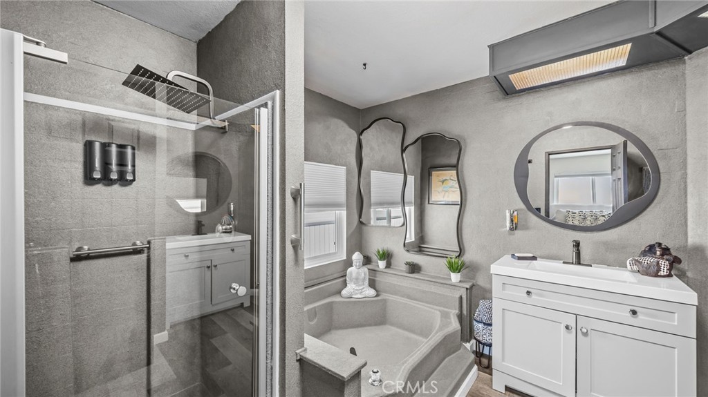 23301 Ridge Rte Drive, Unit 95 Laguna Hills, CA 92653 - Photo 13 of 35 a bathroom with a toilet a sink and a mirror