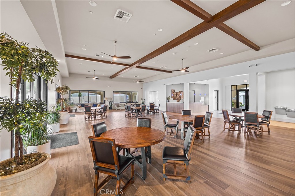 23301 Ridge Rte Drive, Unit 95 Laguna Hills, CA 92653 - Photo 30 of 35 a view of a dining room with furniture window and wooden floor