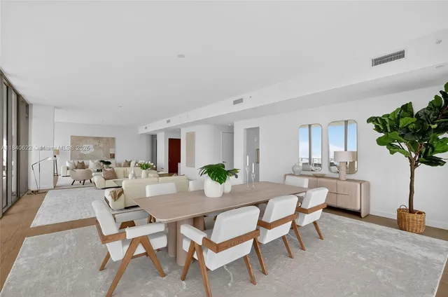 a kitchen with stainless steel appliances granite countertop a sink a stove cabinets and wooden floor