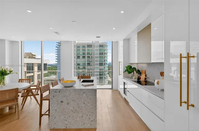 a balcony view with a couch and city view