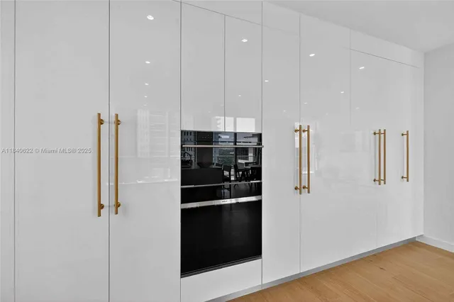 a bath room with a potted plant and a bathtub