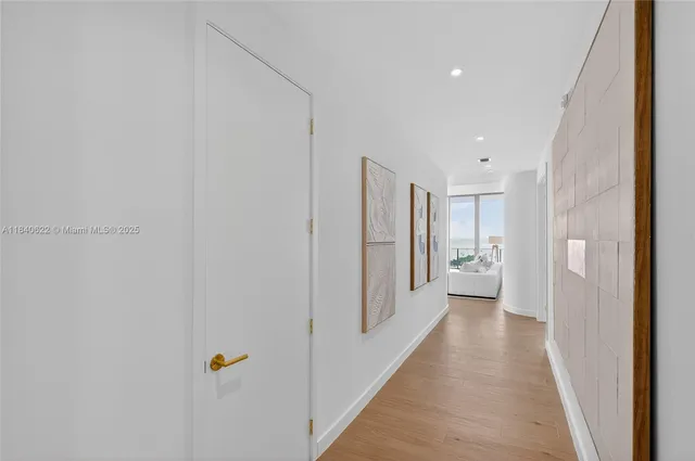 a bedroom with a large bed and a large window