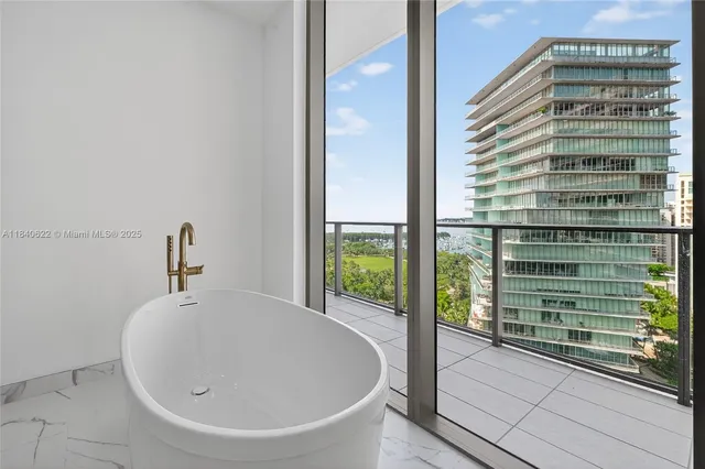 a bathroom with a shower and a sink