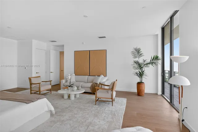 a room with furniture and a large window