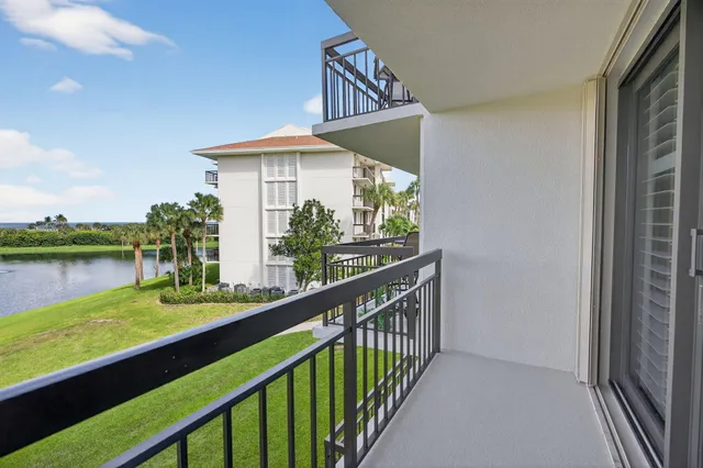 a view of hallway with window and furniture