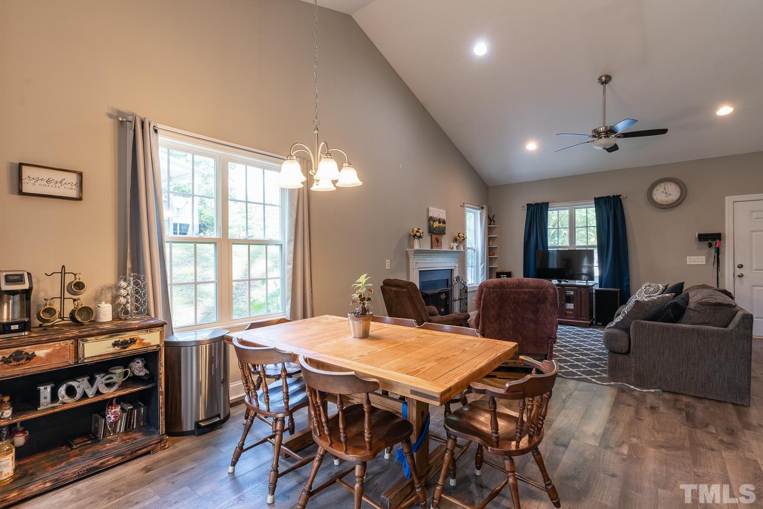 532 Cooper Street Clayton, NC 27520 - Photo 11 of 33 a view of a dining room with furniture window and wooden floor