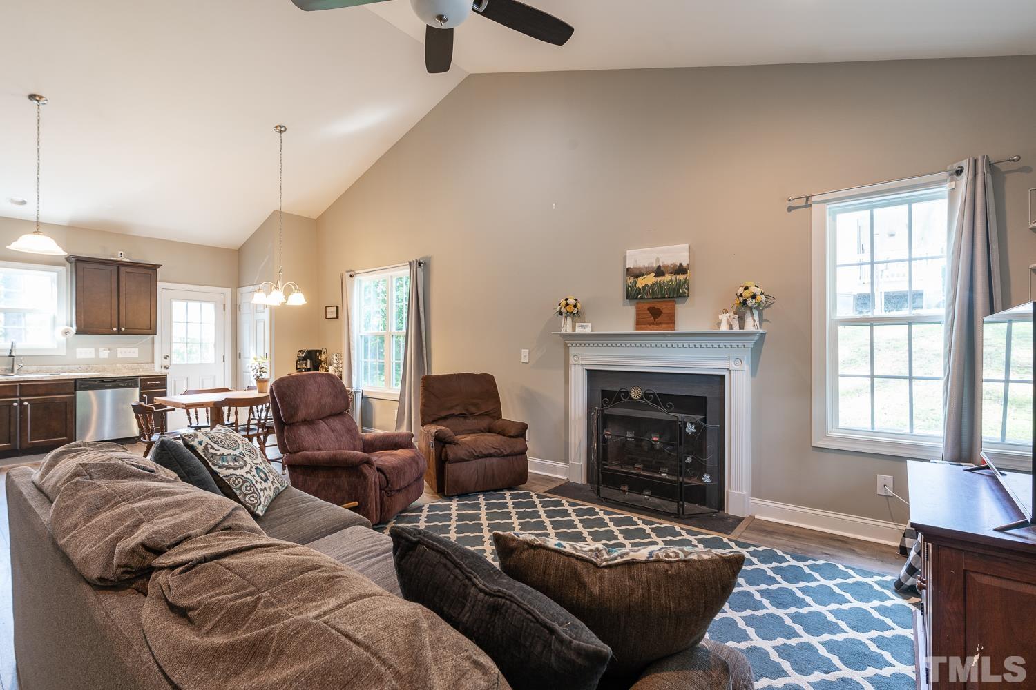 532 Cooper Street Clayton, NC 27520 - Photo 14 of 33 a living room with furniture and a fireplace