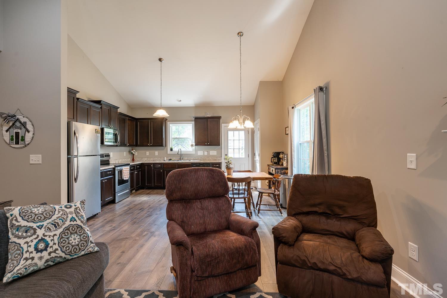 532 Cooper Street Clayton, NC 27520 - Photo 15 of 33 a living room with furniture and kitchen view
