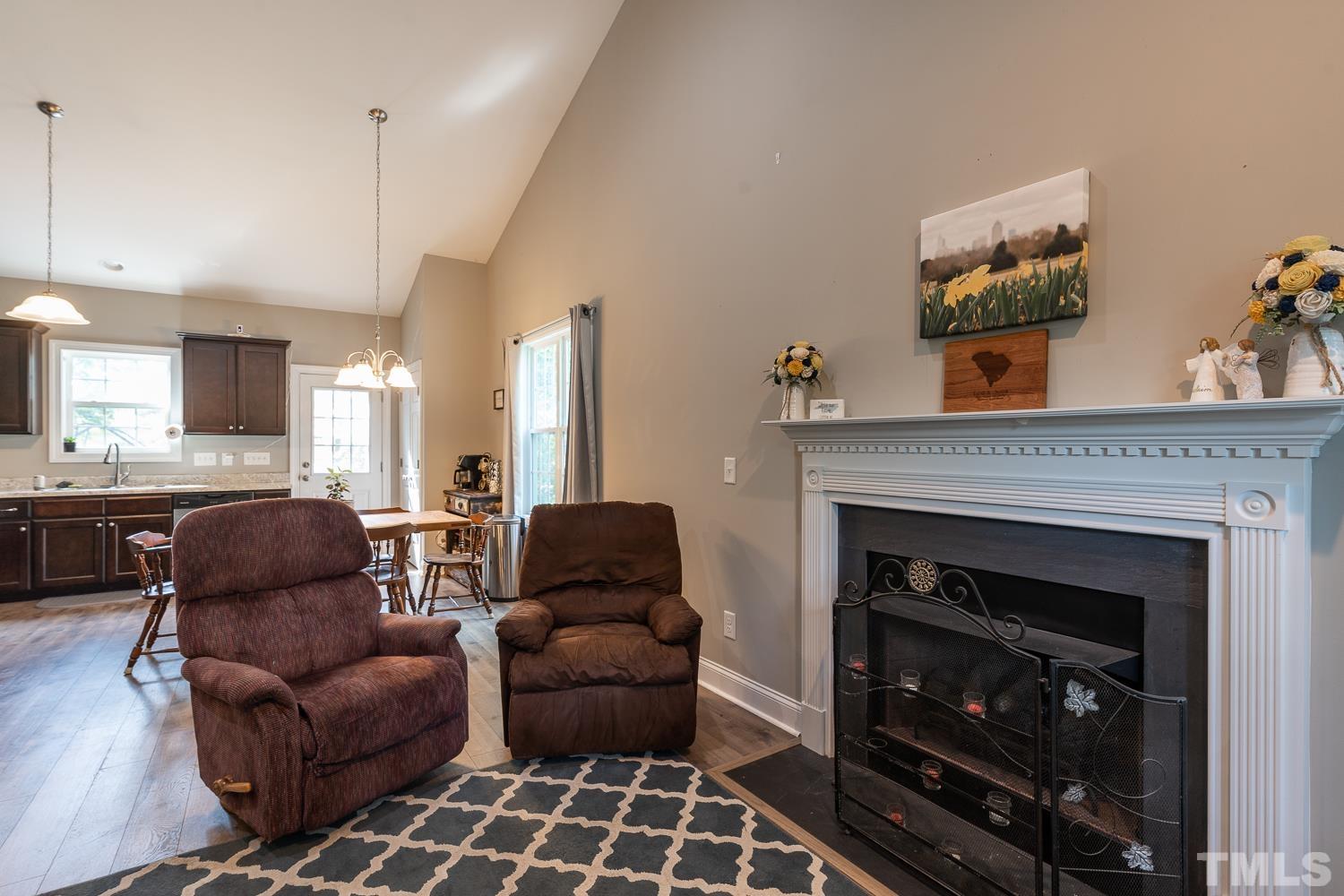 532 Cooper Street Clayton, NC 27520 - Photo 16 of 33 a living room with furniture and a fireplace