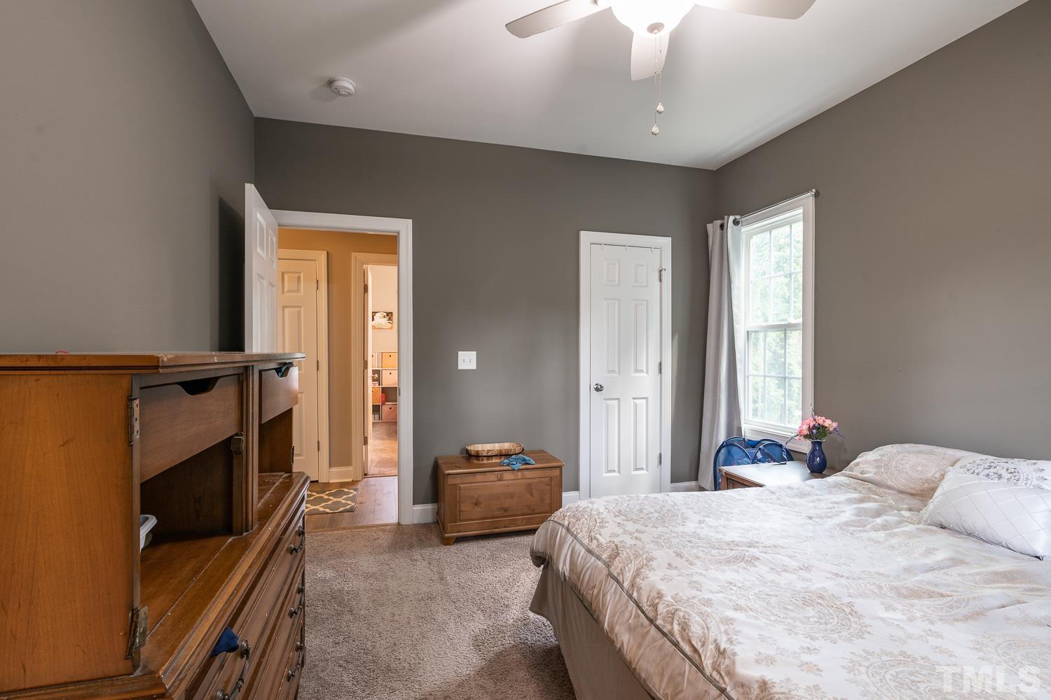 532 Cooper Street Clayton, NC 27520 - Photo 20 of 33 a bedroom with bed and a window