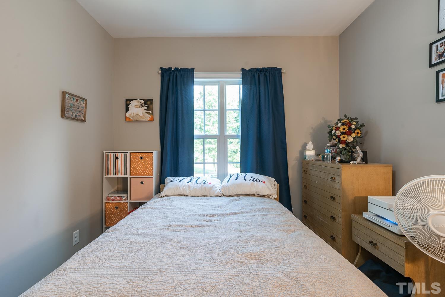 532 Cooper Street Clayton, NC 27520 - Photo 24 of 33 a bedroom with a bed and a window