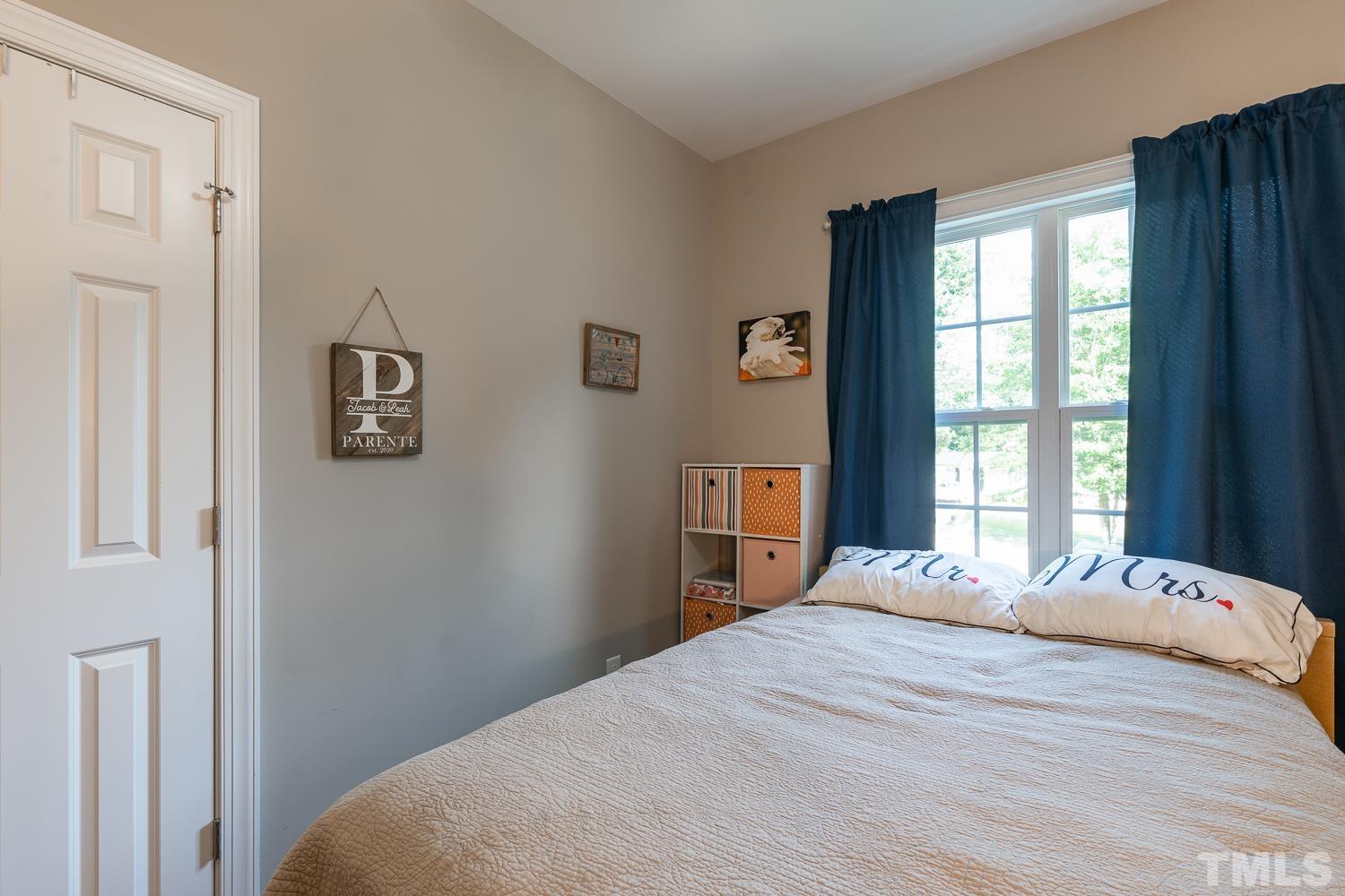 532 Cooper Street Clayton, NC 27520 - Photo 26 of 33 a bedroom with a bed and a window