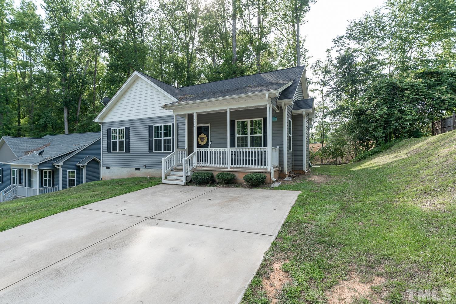 532 Cooper Street Clayton, NC 27520 - Photo 3 of 33 a front view of a house with yard