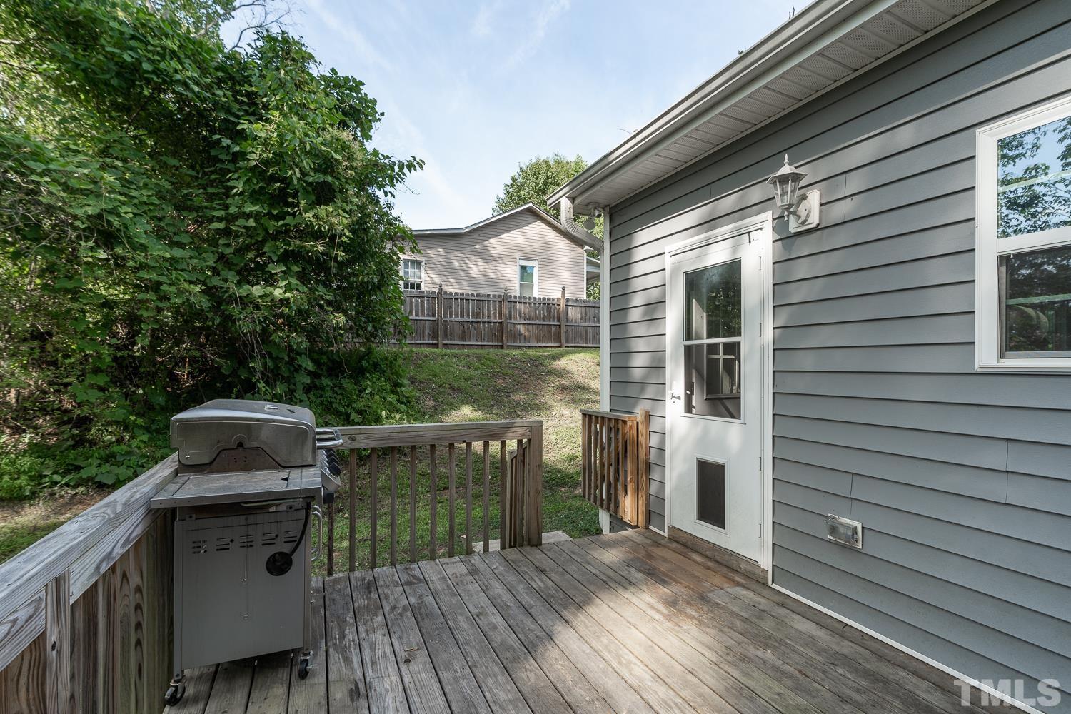 532 Cooper Street Clayton, NC 27520 - Photo 31 of 33 a view of a deck with wooden floor and fence