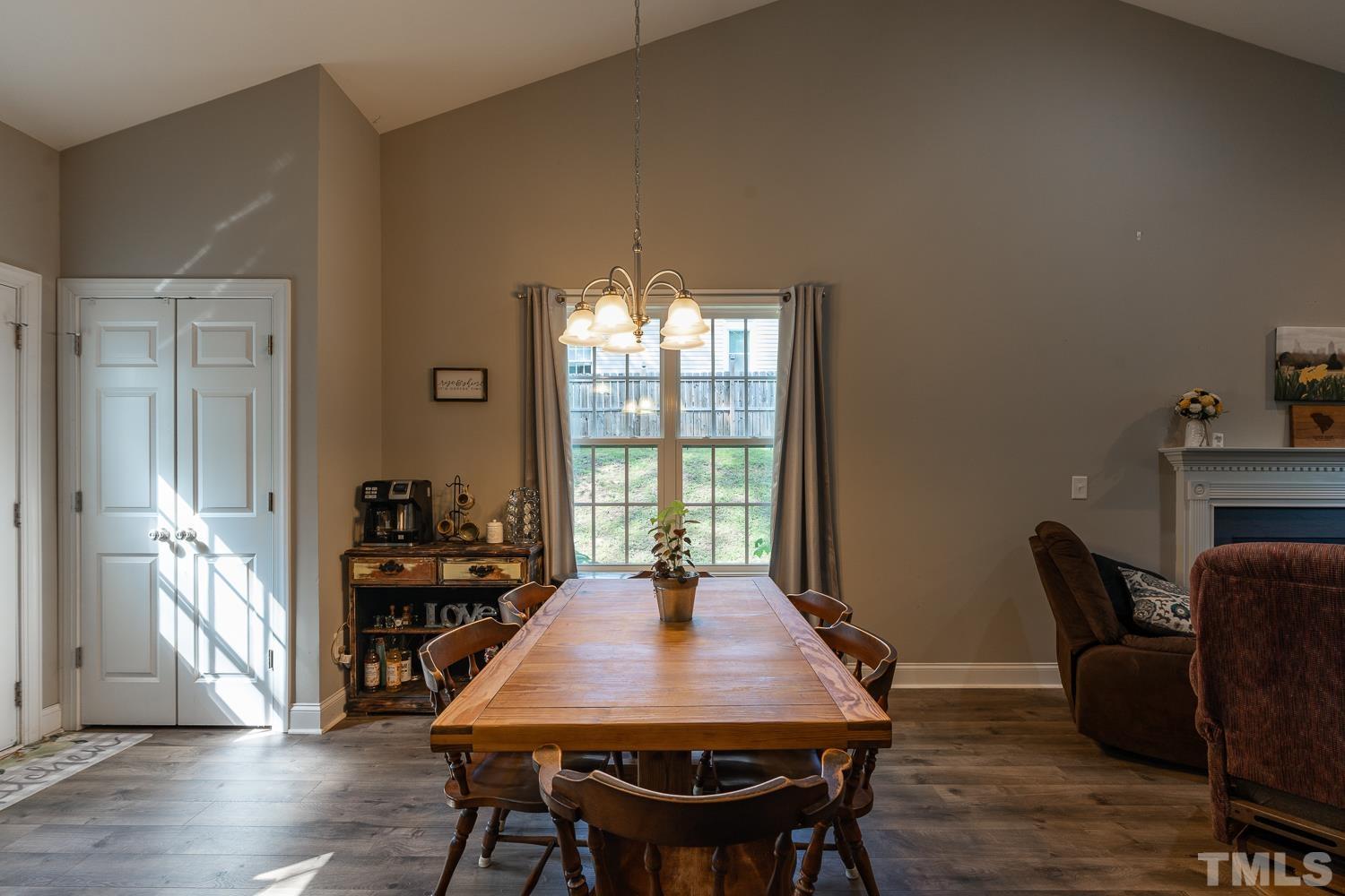 532 Cooper Street Clayton, NC 27520 - Photo 9 of 33 a view of a dining room with furniture window and wooden floor