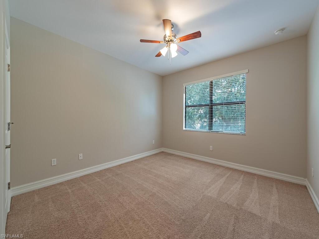 7777 Bristol Circle Naples, FL 34120 - Photo 12 of 22 an empty room with a window