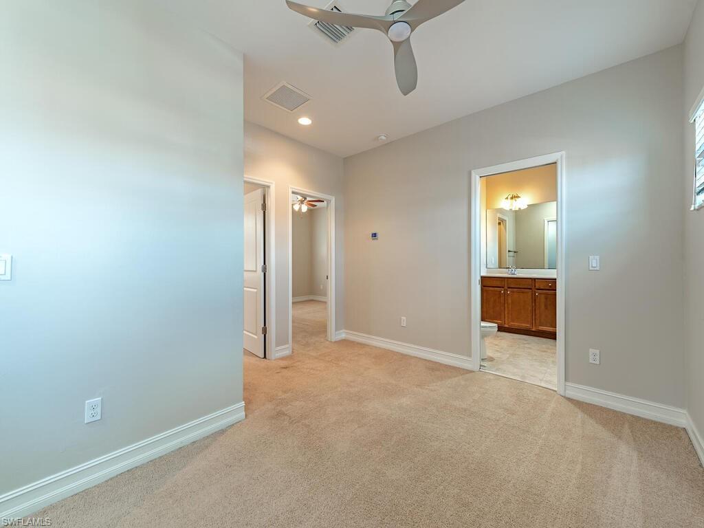 7777 Bristol Circle Naples, FL 34120 - Photo 15 of 22 an empty room with a empty space and windows