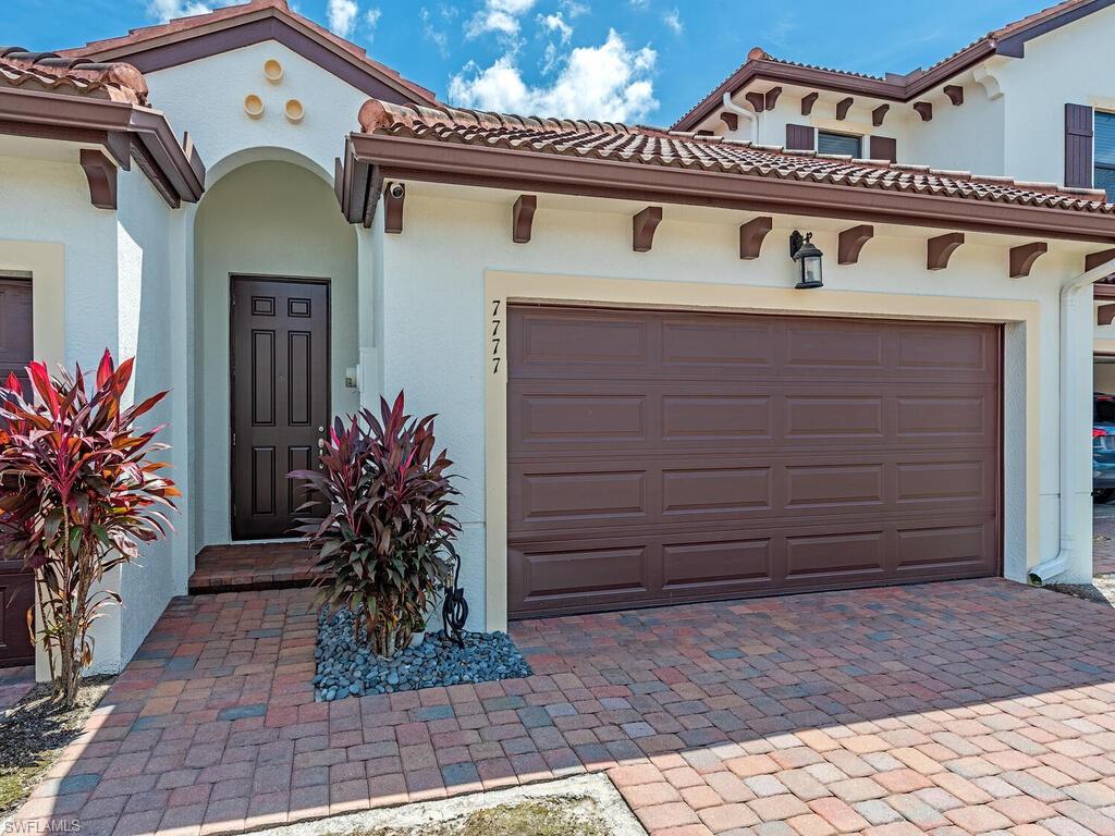 7777 Bristol Circle Naples, FL 34120 - Photo 2 of 22 a front view of a house