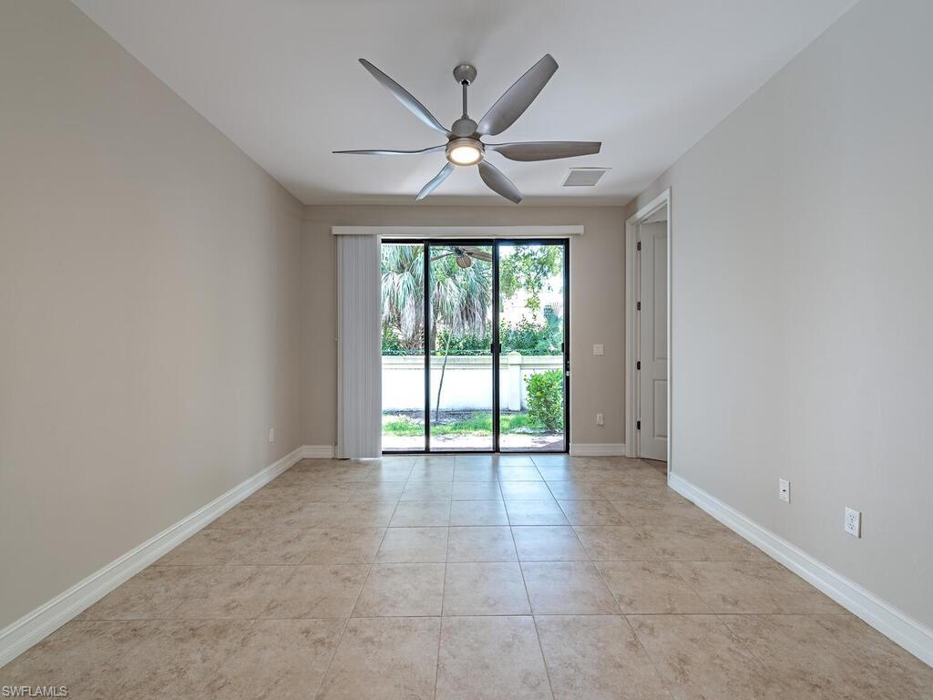 7777 Bristol Circle Naples, FL 34120 - Photo 3 of 22 a view of an empty room with a window