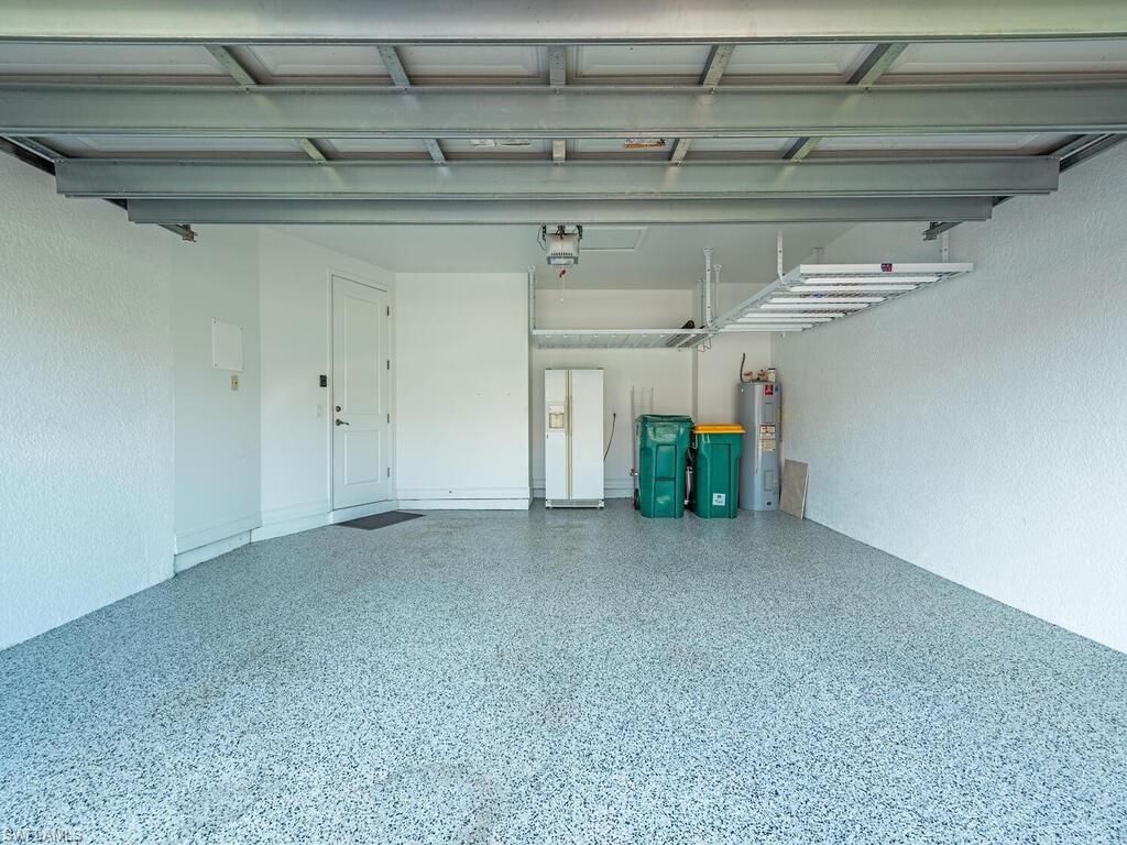 7777 Bristol Circle Naples, FL 34120 - Photo 8 of 22 a view of a room with racks on the wall