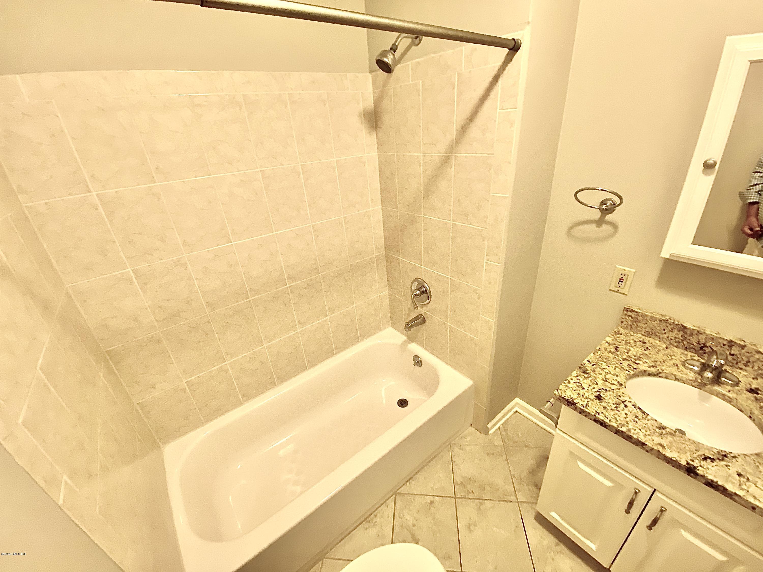 131 Mason Street, Unit 2 Greenwich, CT 06830 - Photo 13 of 14 a bathroom with a tub and shower