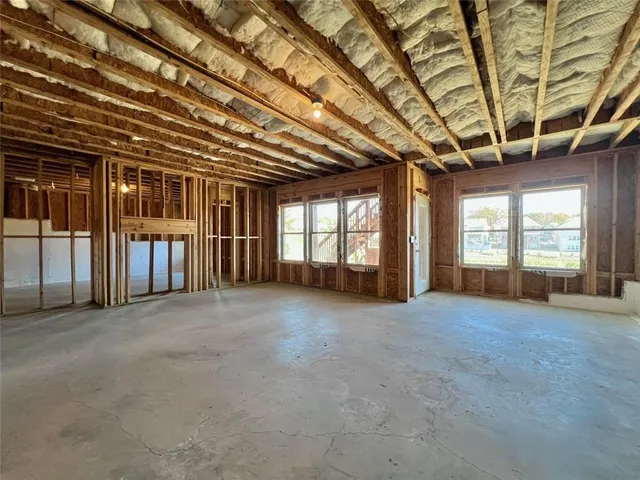 a view of an empty room with a fireplace