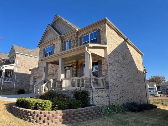 a front view of a house with a yard