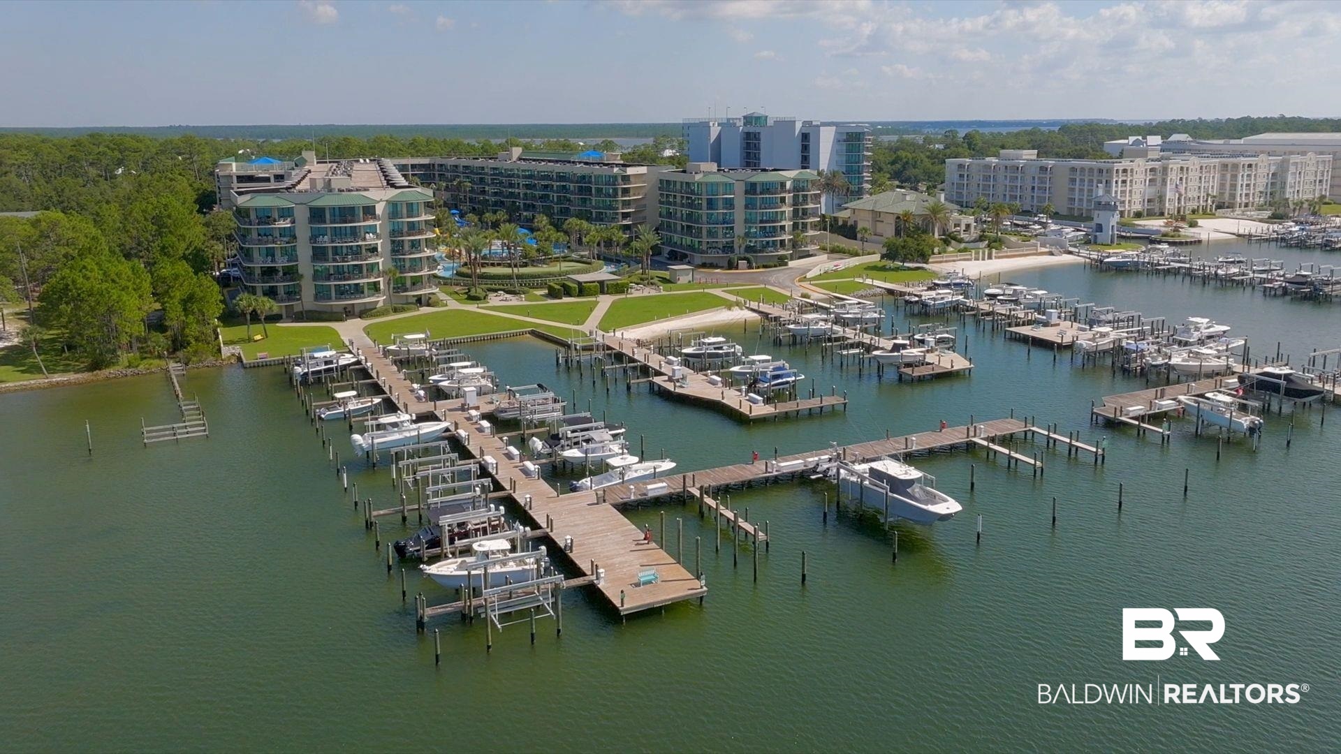 27580 Canal Road, Unit 1427 Orange Beach, AL 36561 - Photo 4 of 38 Aerial view of numerous boat docks and a large body of water