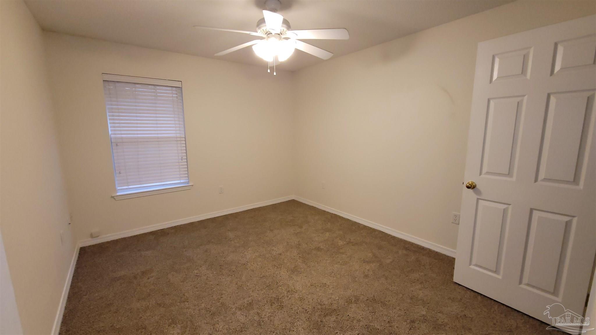 3741 Monopoly Court Gulf Breeze, FL 32563 - Photo 12 of 17 an empty room with windows and fan