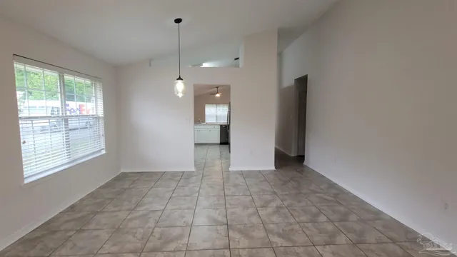 a view of a kitchen with a sink and a window