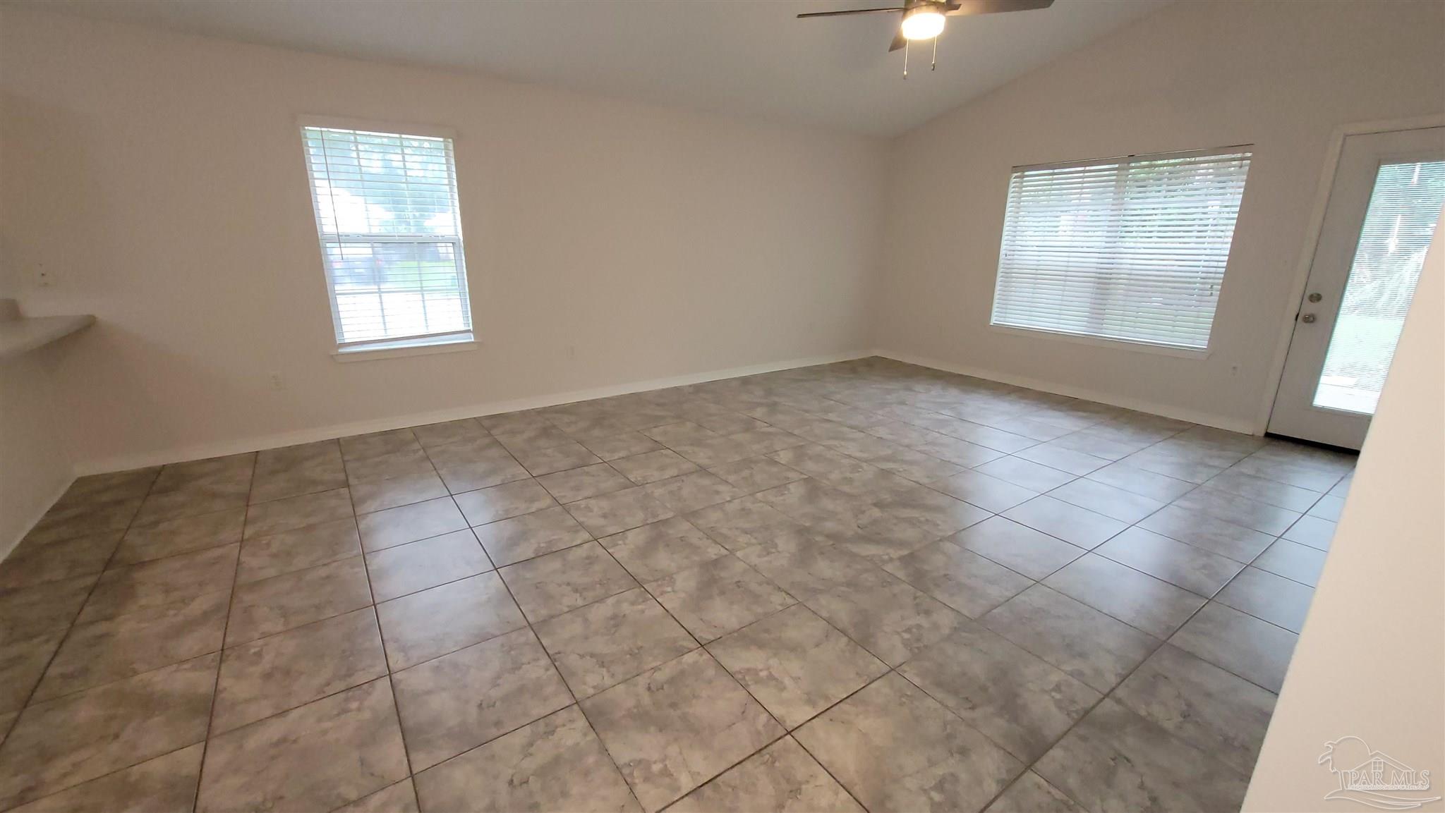 3741 Monopoly Court Gulf Breeze, FL 32563 - Photo 7 of 17 an empty room with windows