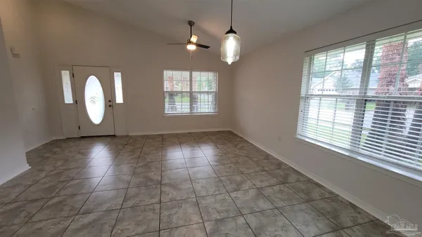 a view of an empty room with a window