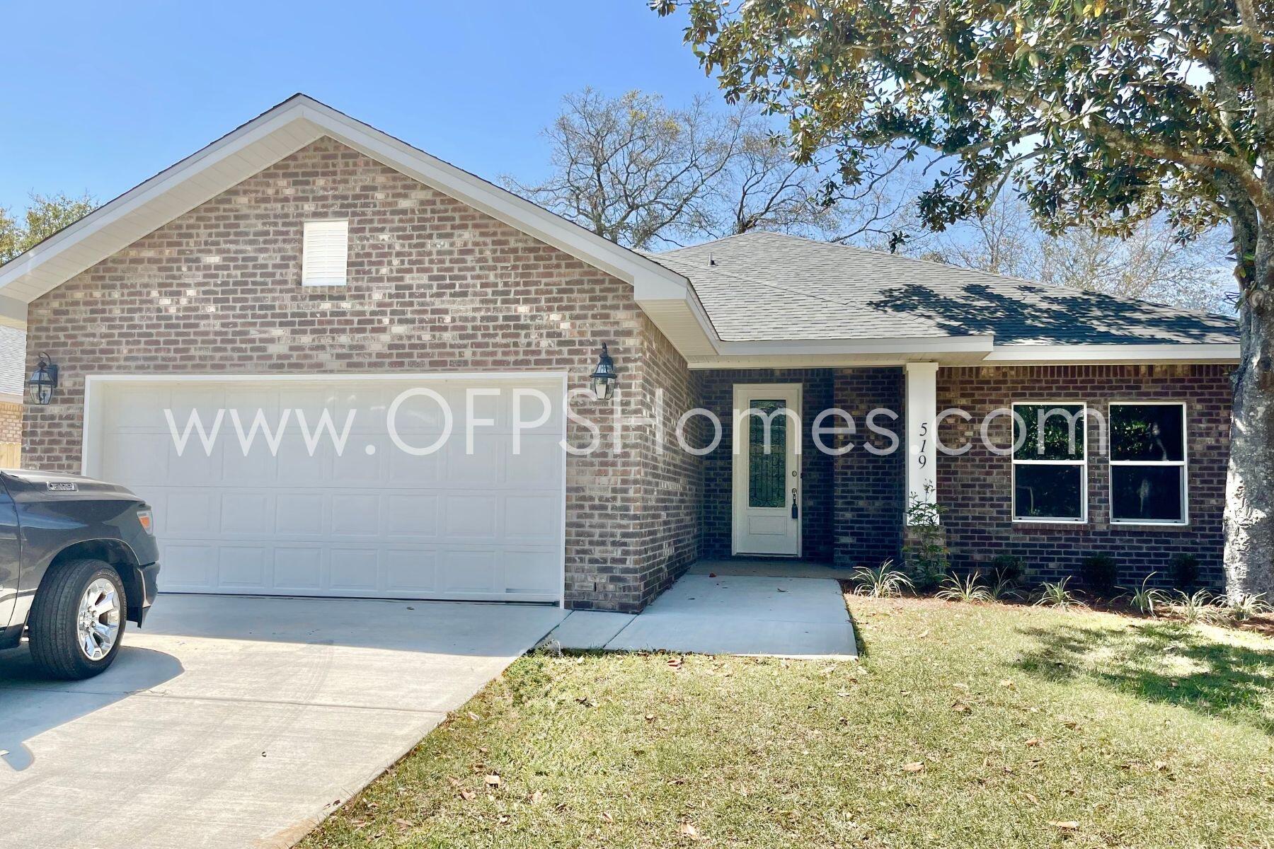 519 Friendship Road Mary Esther, FL 32569 - Photo 2 of 10 a front view of a house with a yard